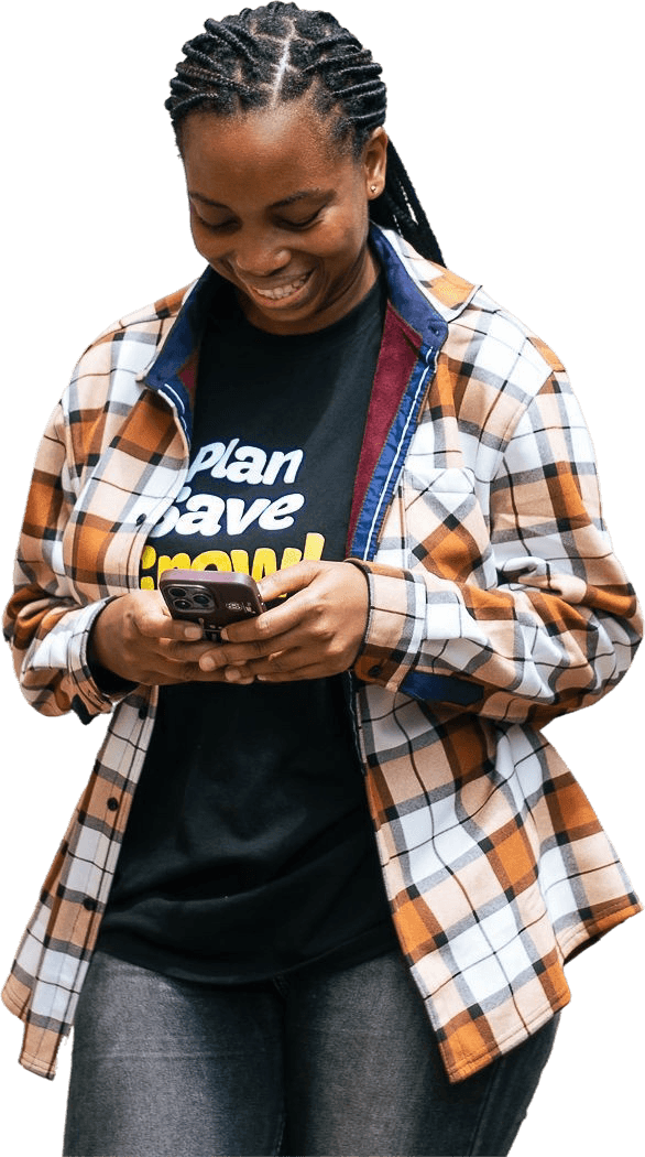 Girl smiling while looking at her phone.